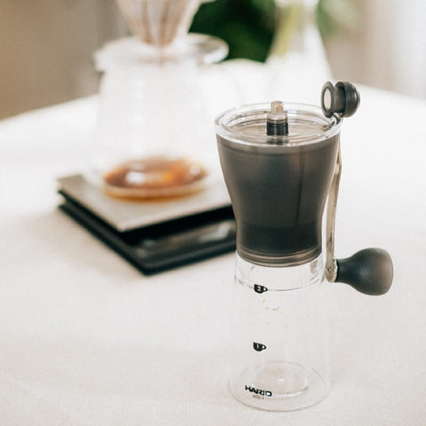 Hario Ceramic Coffee Mill Original Black handle stored to save space during travel.