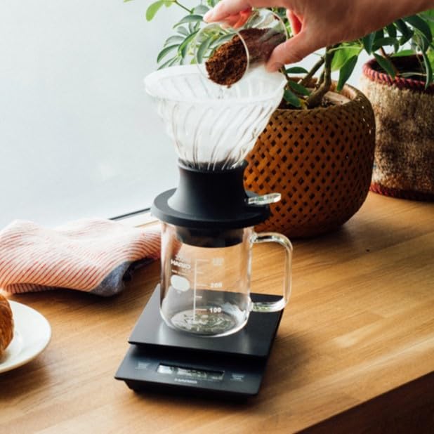 Hario Switch glass V60 cone made of heatproof glass for durability.