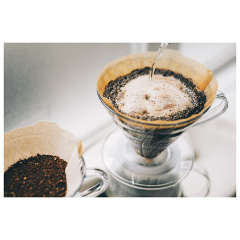 Hario V60 brew setup with natural filters, showcasing clear extraction