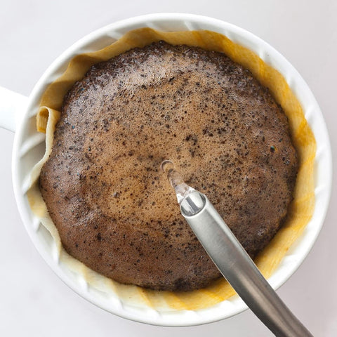 Hario V60 ceramic dripper retains heat for stable brewing temperatures.