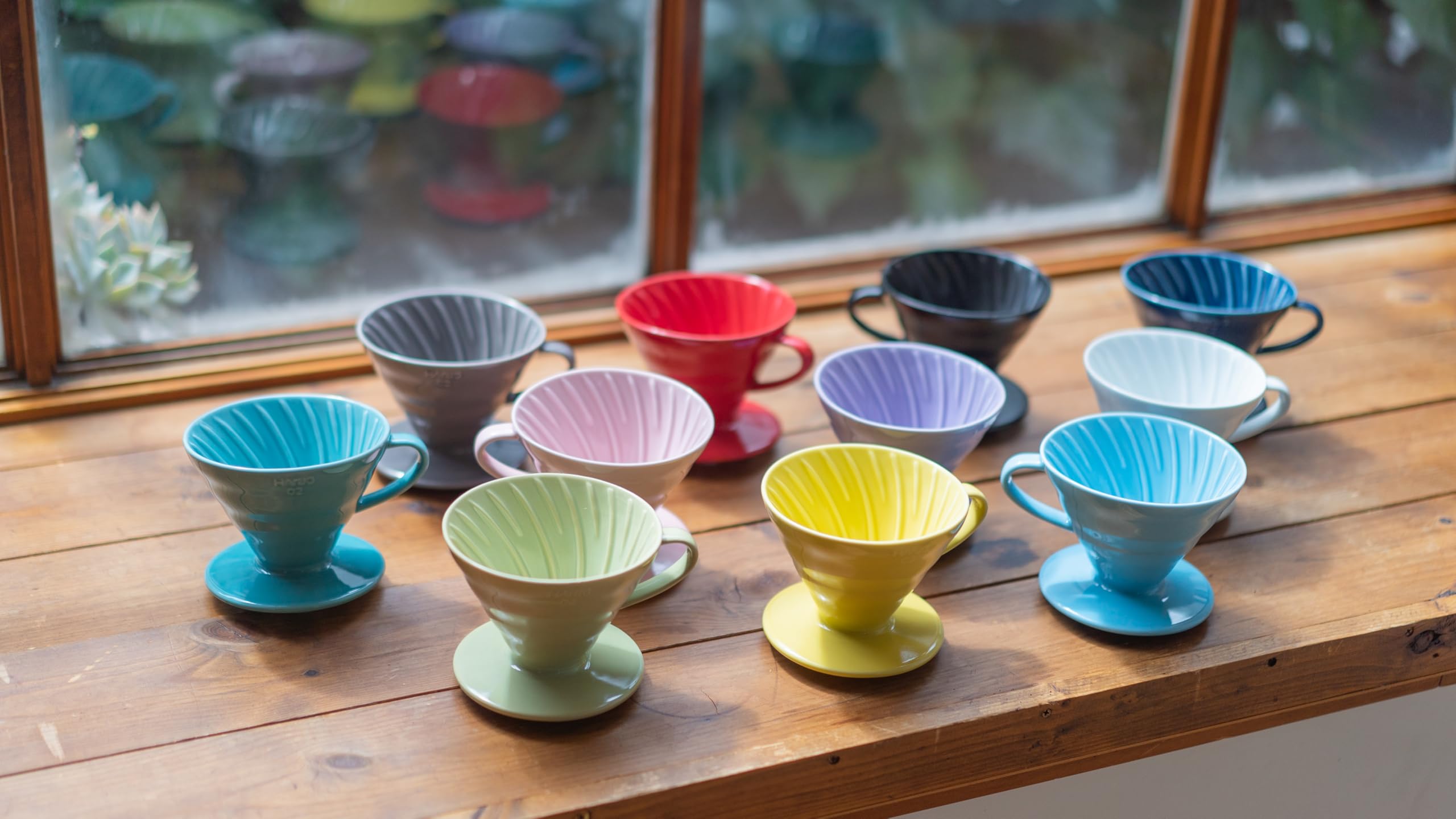 Hario V60 ceramic dripper in white highlights rich, aromatic coffee flavors.