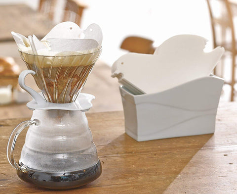 Hario V60 ceramic filter stand with dripper supports a clean home pour-over.