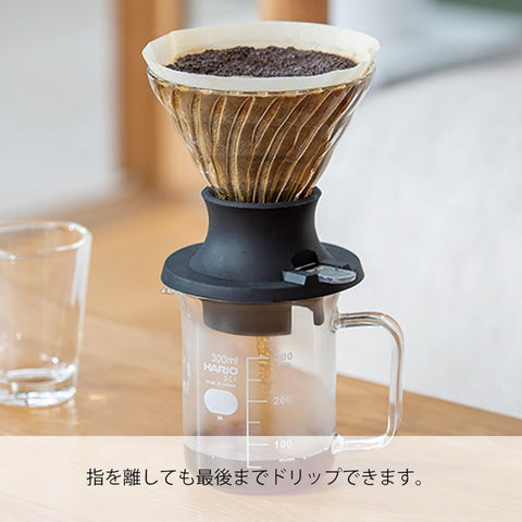 Hario V60 glass cone, heatproof and stable for precise brewing.