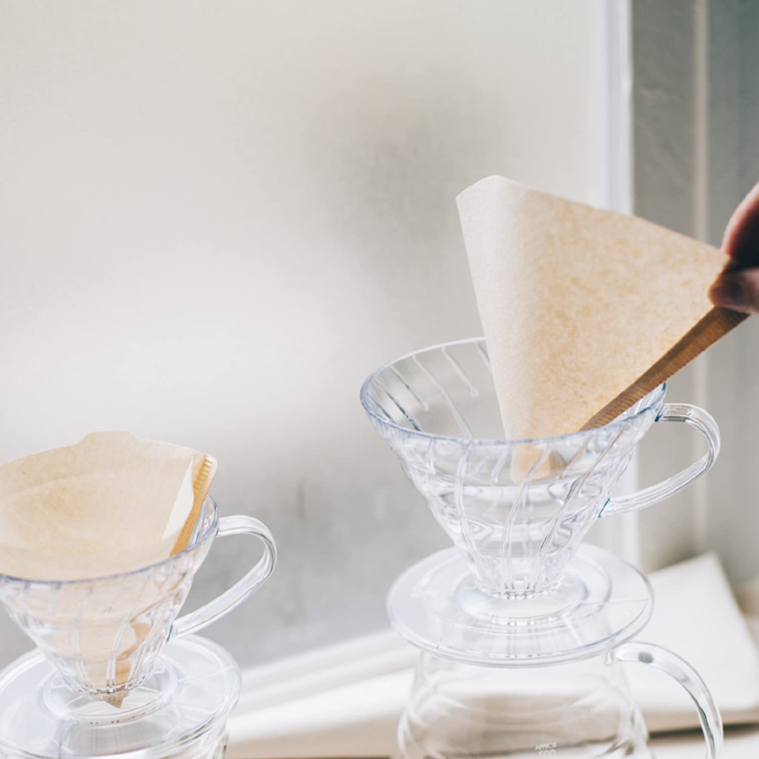 Hario V60 plastic dripper size 03 captures brew into a cup for 1-6 servings