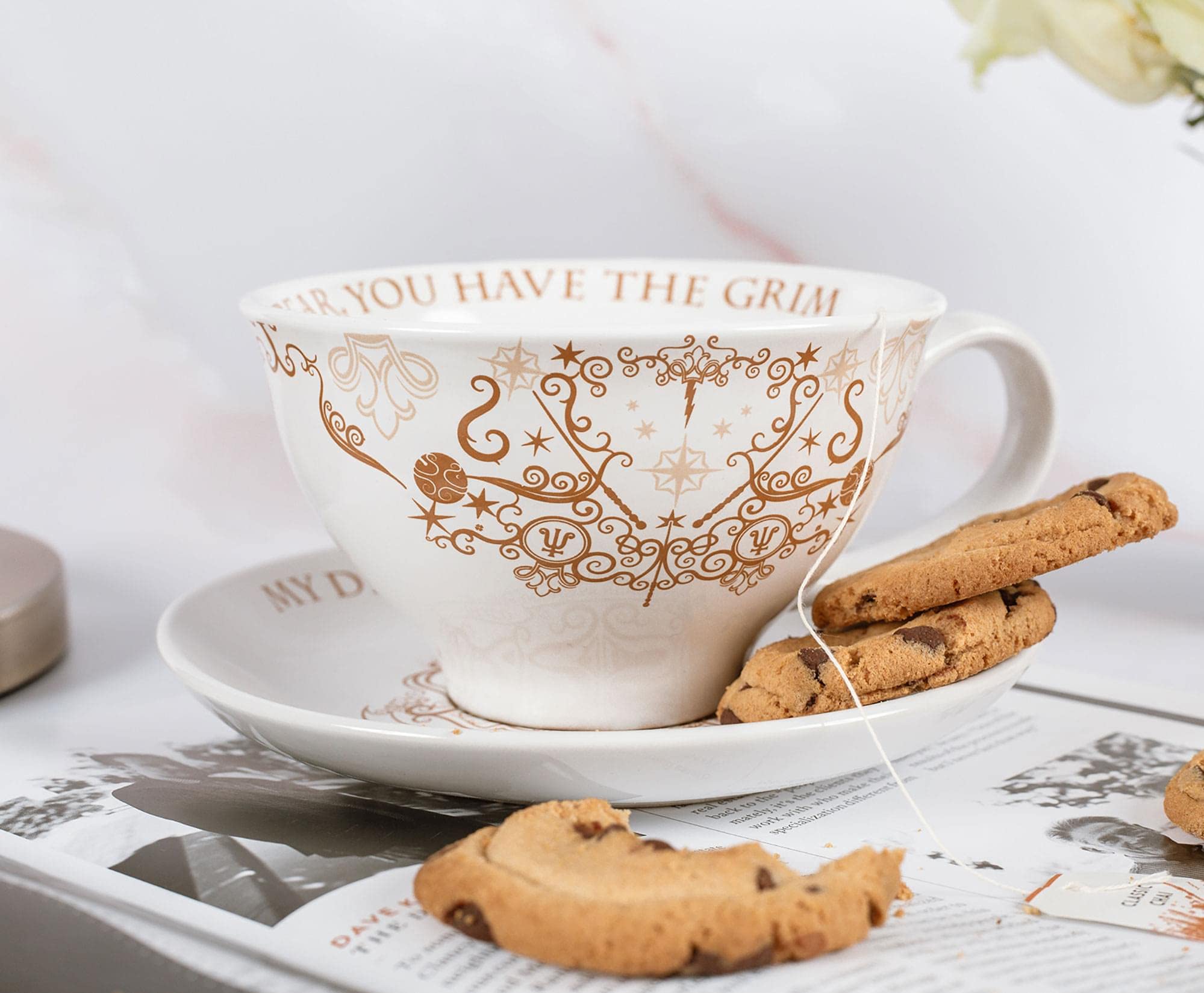 Close-up of Grim motif on Harry Potter teacup and saucer, ideal for collectors display.