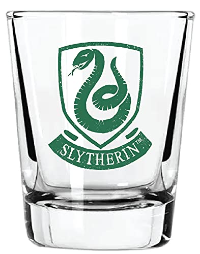Close-up on Harry Potter crest detailing on a clear shot glass