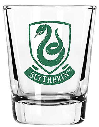 Close-up on Harry Potter crest detailing on a clear shot glass