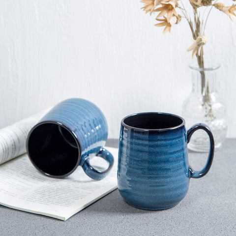HASENSE mug held in hand showing comfortable grip for extended sipping.