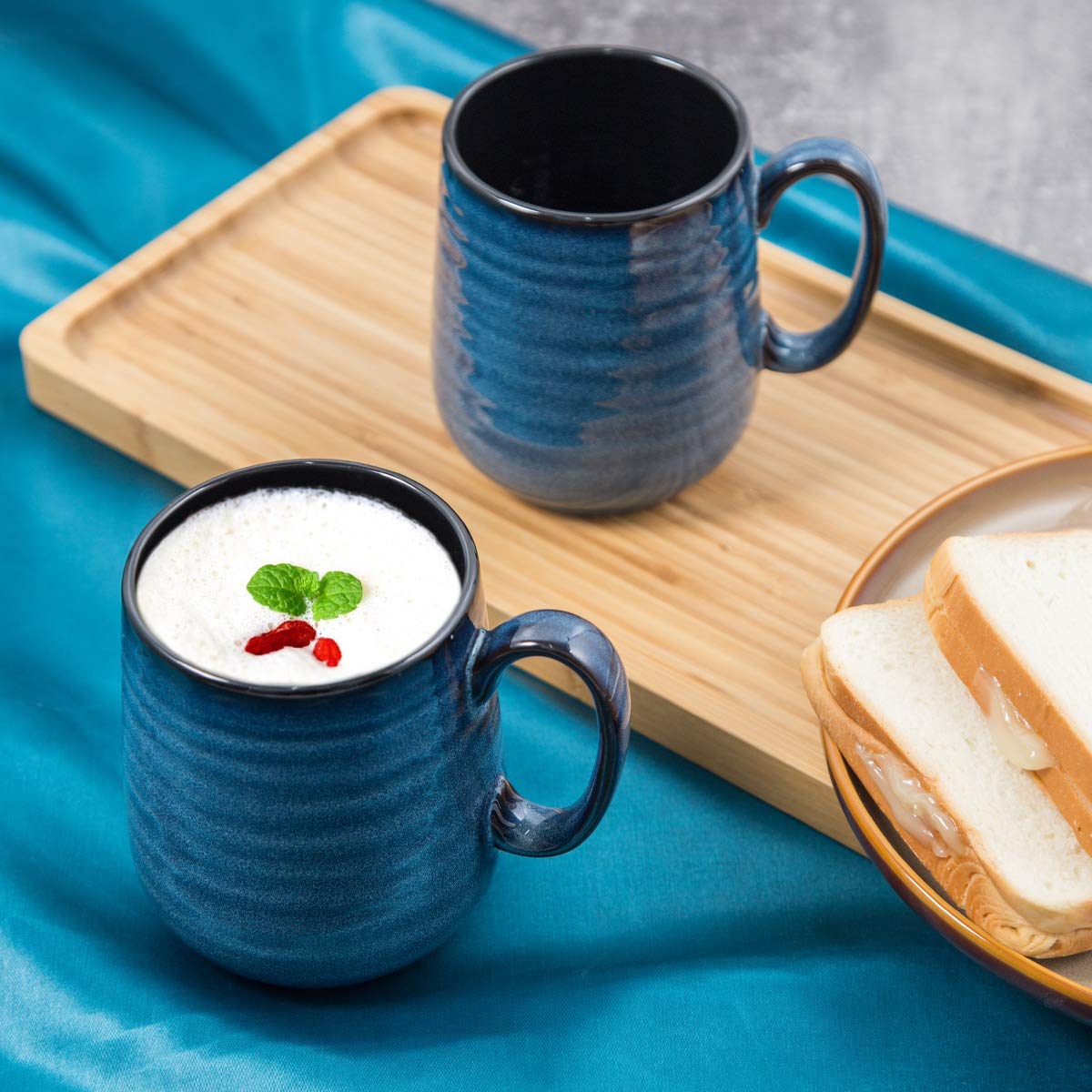 HASENSE mugs stacked neatly, showcasing the smooth glaze and elegant kitchen decor.