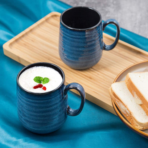 HASENSE mugs stacked neatly, showcasing the smooth glaze and elegant kitchen decor.