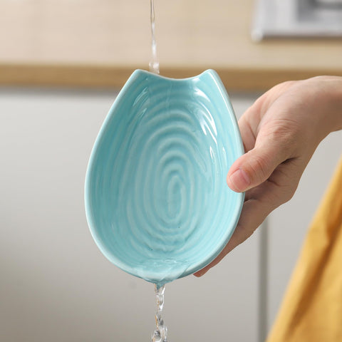HASENSE teal spoon rest provides a vibrant counter accessory and functional storage.