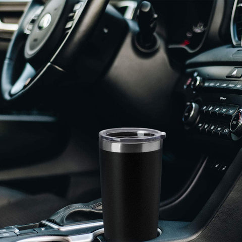 Tumbler seated in car cup holder, compatible for commutes.