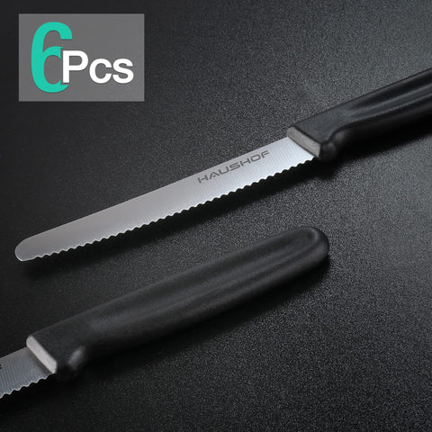 HAUSHOF steak knife close-up showing serrations and sharp edge for clean slicing.