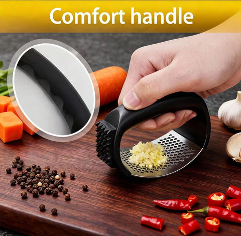 HavenNest garlic press demonstrates rocking action for quick, effortless crushing.