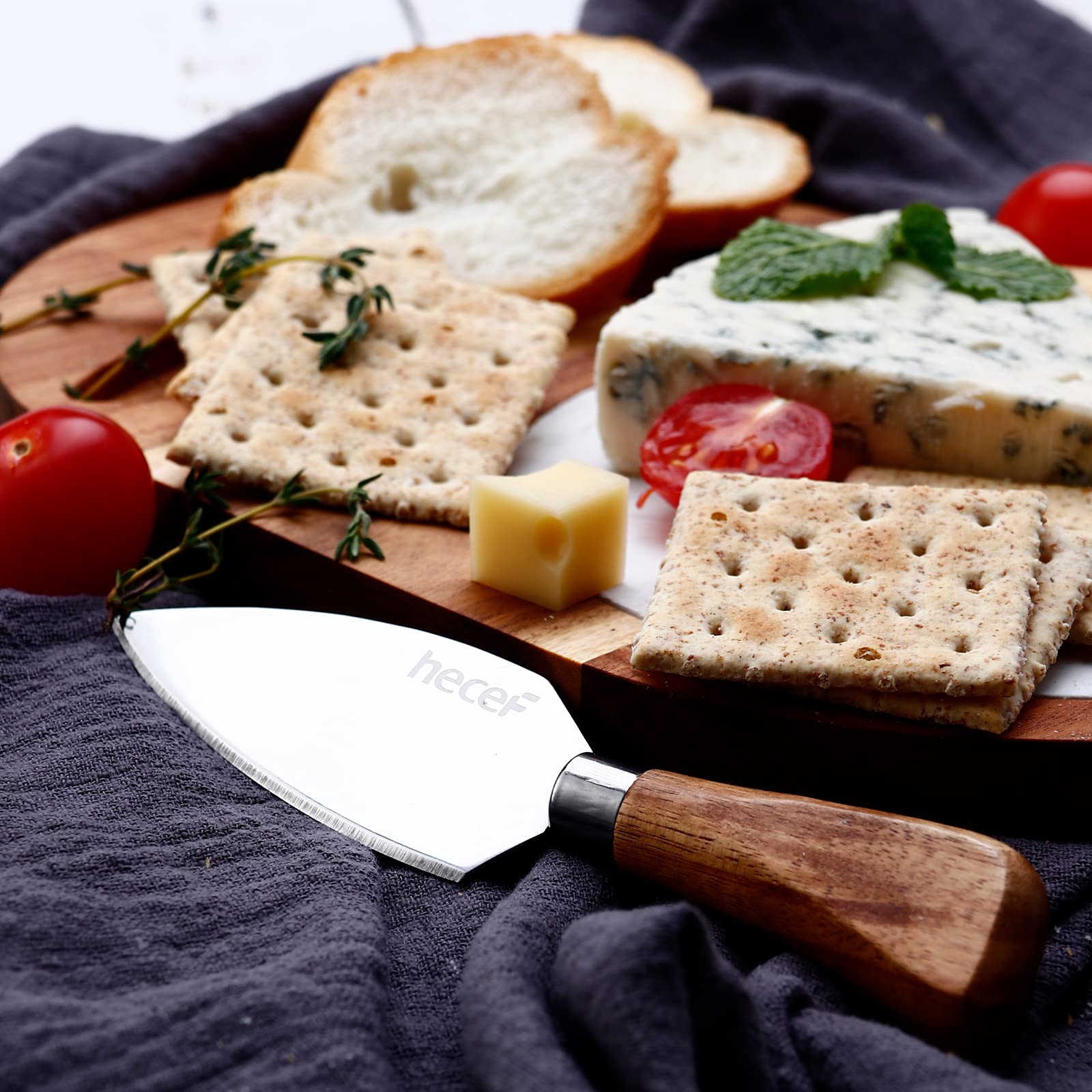 The hecef board set contents include board, marble panel, and knife.