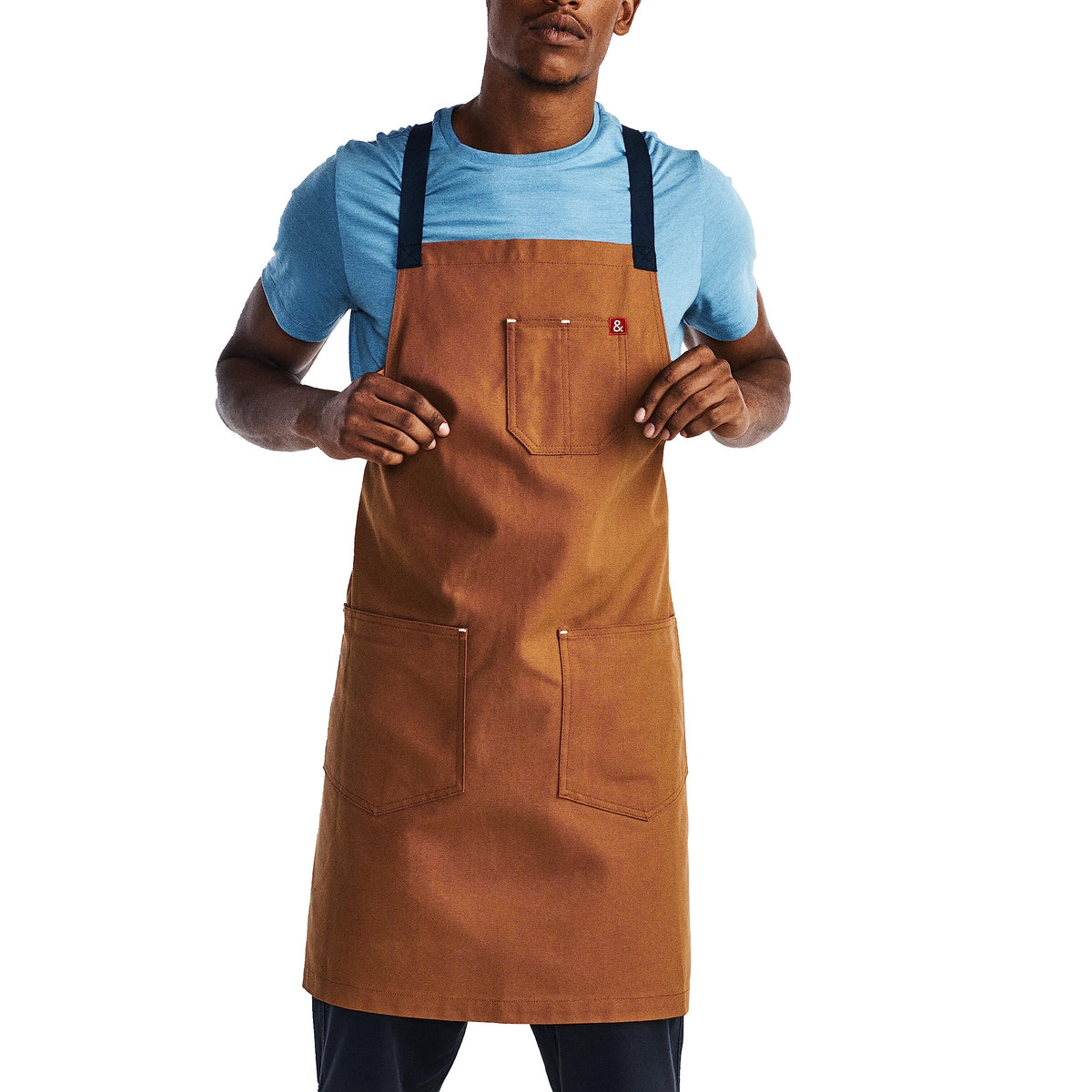 Hedley Bennett Crossback Apron front view highlights even weight distribution for long cooking sessions.