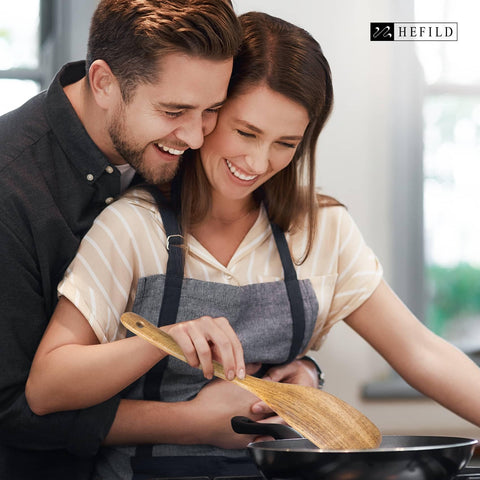 Hefild acacia wood utensils with long handle for comfortable, precise cooking.