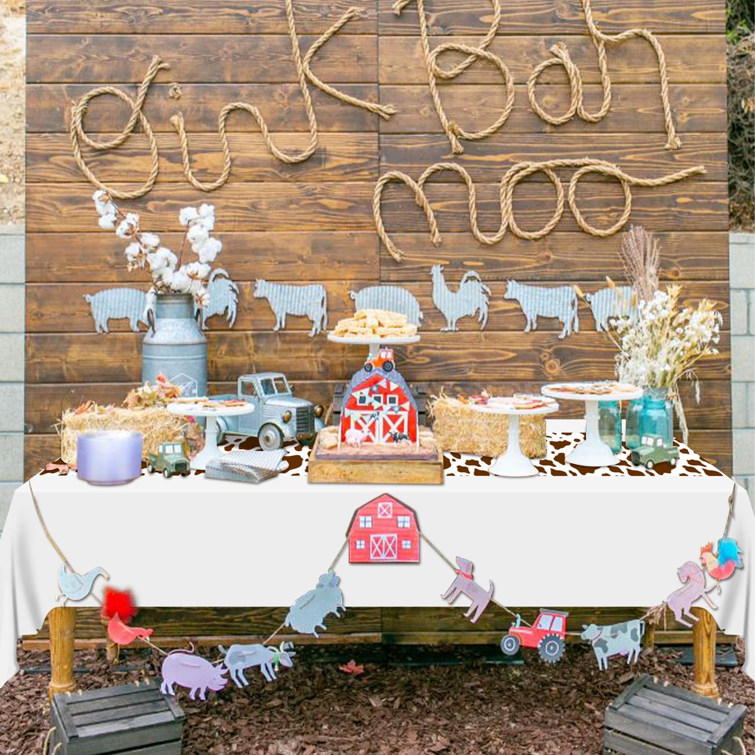 Hegbolke outdoor picnic arrangement with cow print runner under dinnerware.