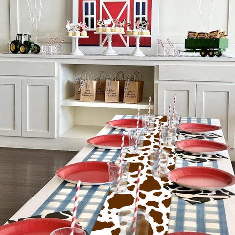 Hegbolke wedding table setup featuring cow print runner adds charming country theme.