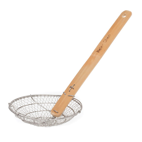 Close-up of Helen's Asian Kitchen Spider Strainer showing durable stainless steel mesh for quick draining.