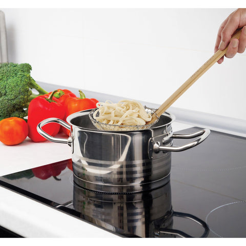 Spider Strainer over a pot, highlighting the heat-resistant bamboo handle for cool-to-touch use.