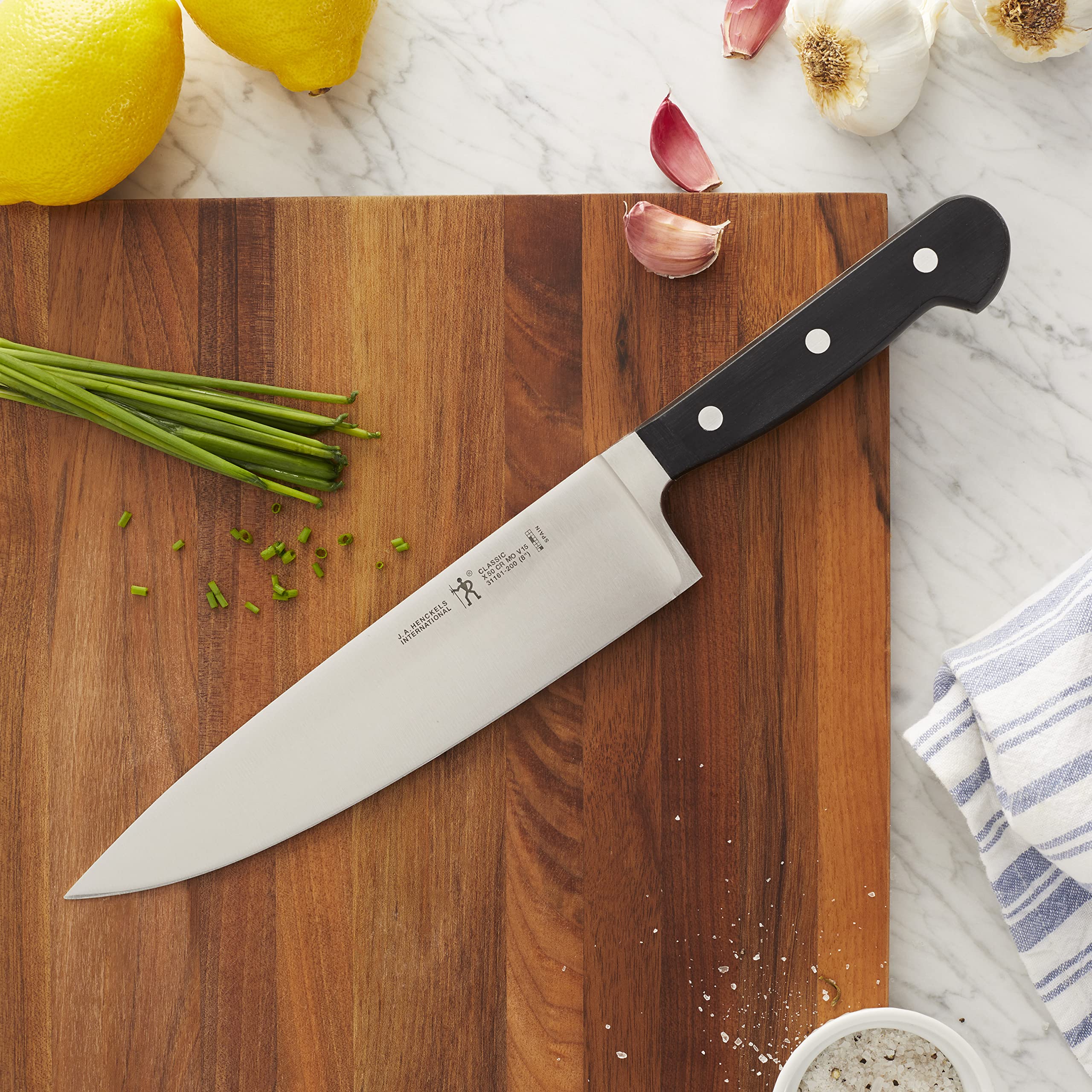 Henckels Classic 8-inch slicing knife handle close-up showing balanced grip