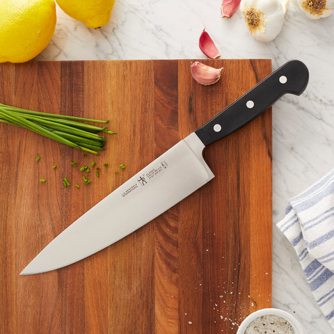 Henckels Classic 8-inch slicing knife handle close-up showing balanced grip