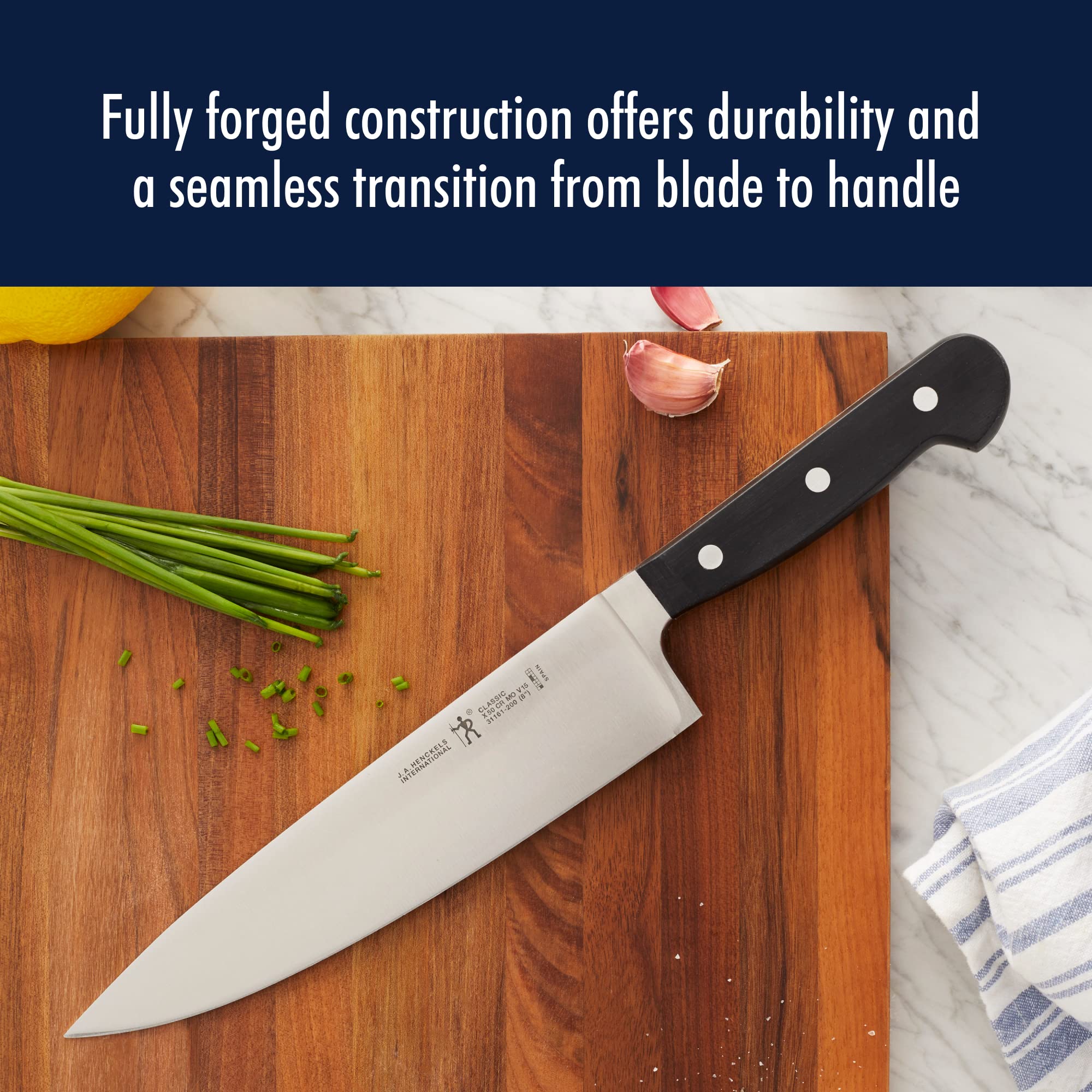 HENCKELS Classic triple-rivet handle design for balanced, comfortable cutting.