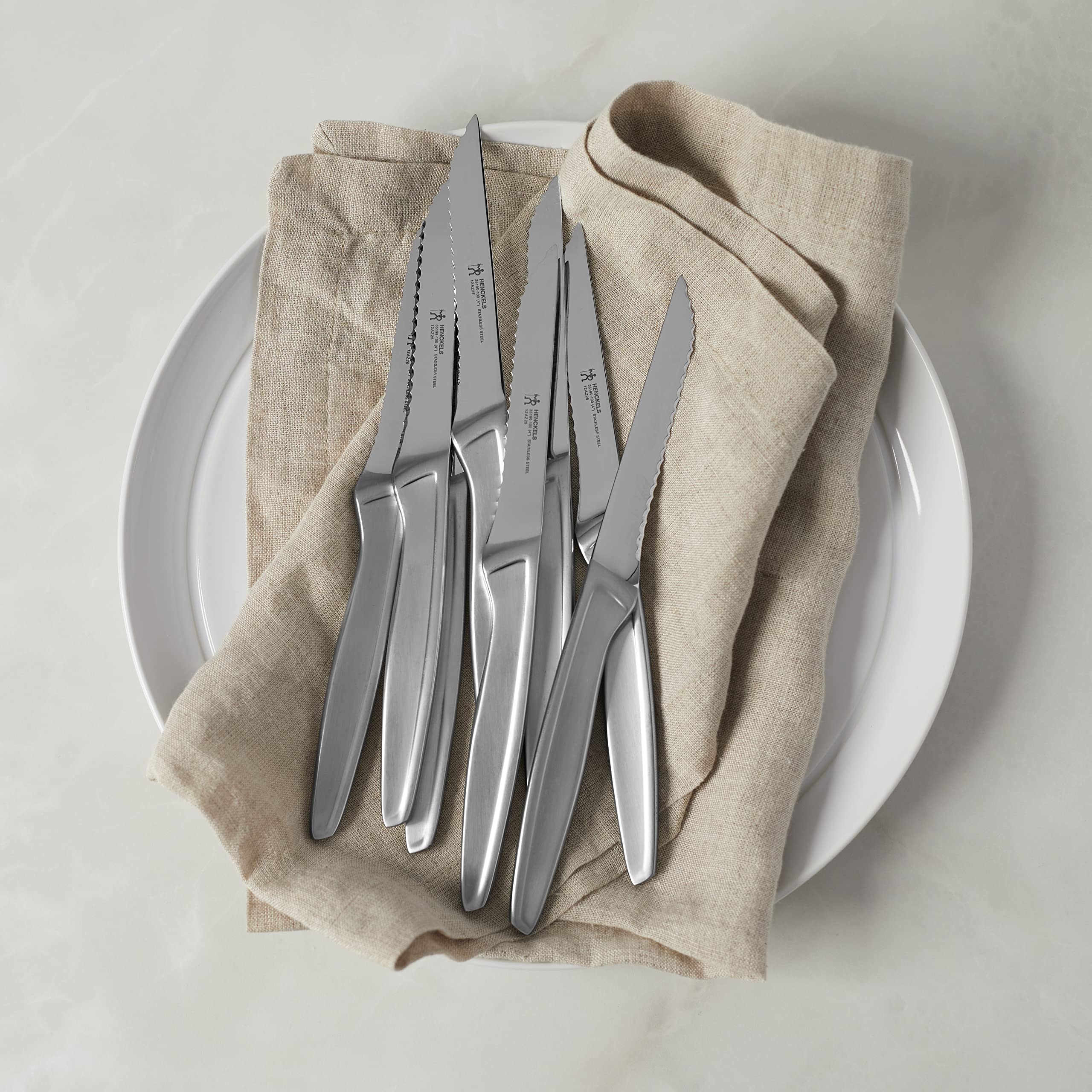 Henckels dishwasher-safe stainless steel knives designed for easy cleanup.