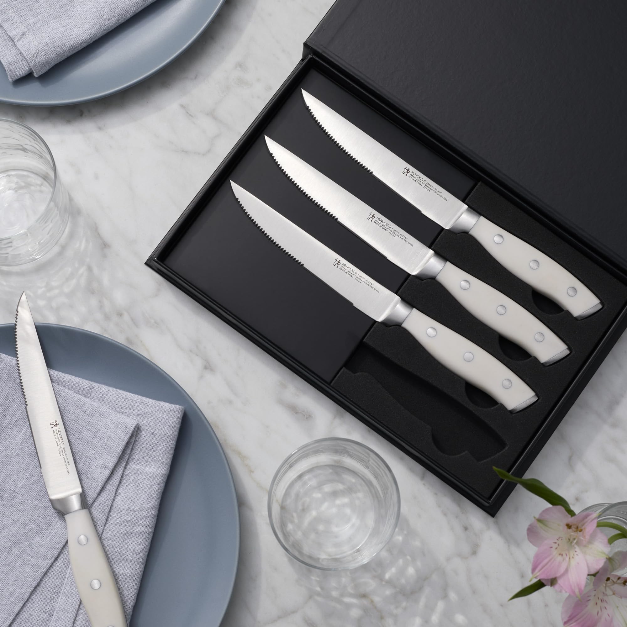 Henckels Forged Accent steak knife handle rivets highlight durable construction.