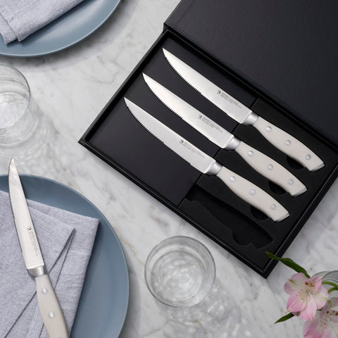 Henckels Forged Accent steak knife handle rivets highlight durable construction.