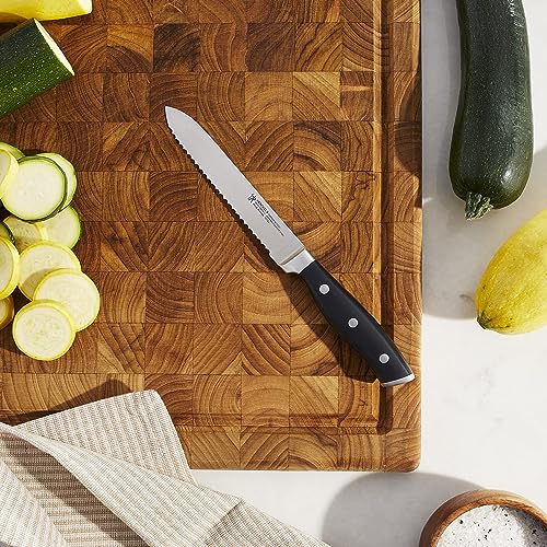 HENCKELS Forged Accent tomato knife with serrated edge for clean, effortless cutting of ripe tomatoes.