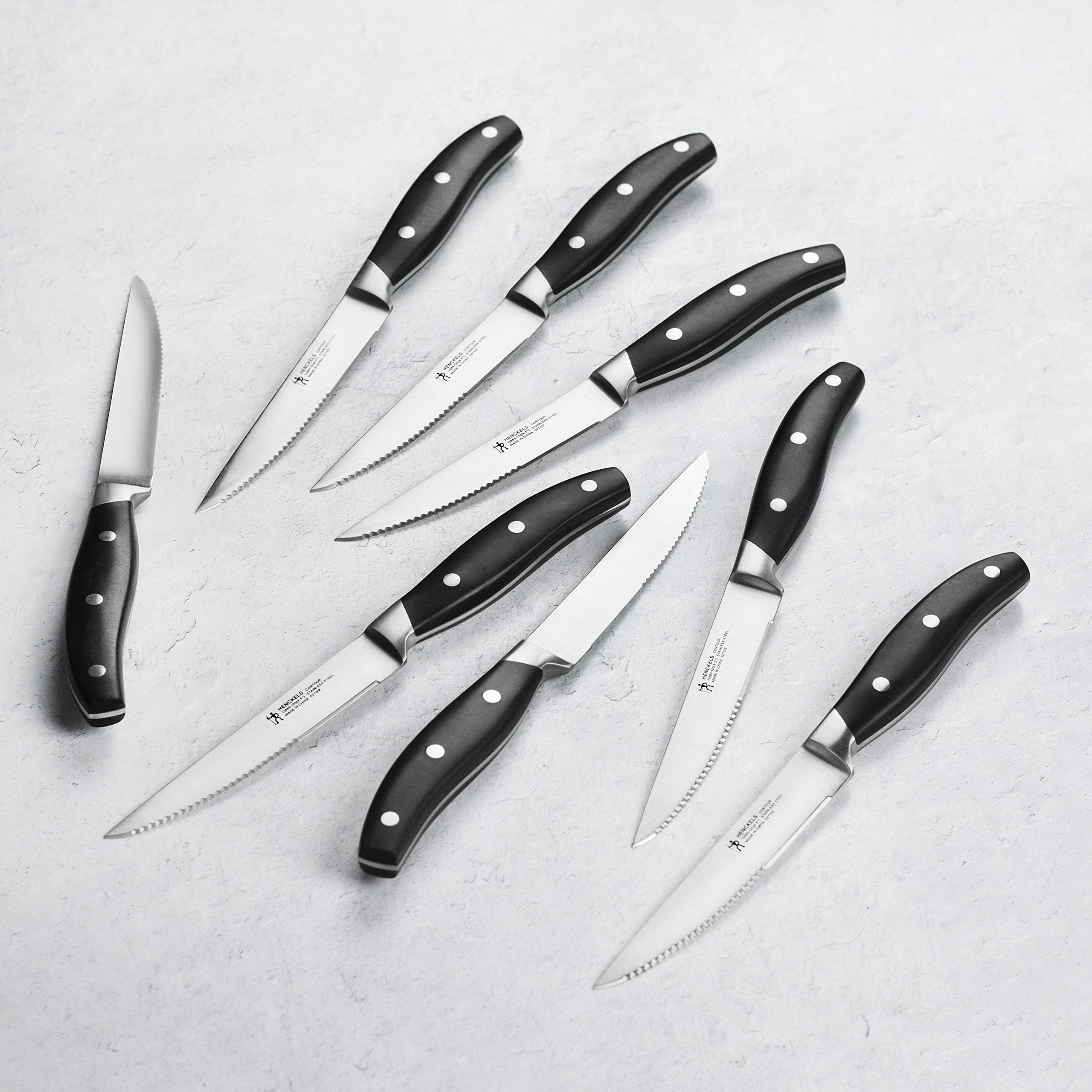 Henckels Forged Contour blade close-up, showcasing precision cutting and edge retention.
