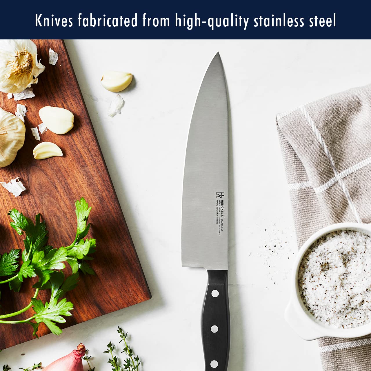 HENCKELS 7-inch hollow-edge Santoku reduces sticking during prep.