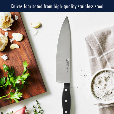 HENCKELS 7-inch hollow-edge Santoku reduces sticking during prep.