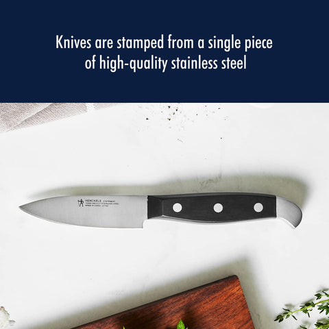 Henckels Statement paring knife handle with curved balance for comfortable use.