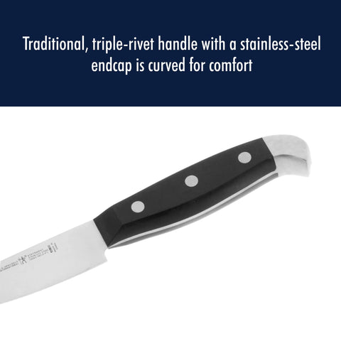 Henckels Statement paring knife in use peeling potato for clean prep.