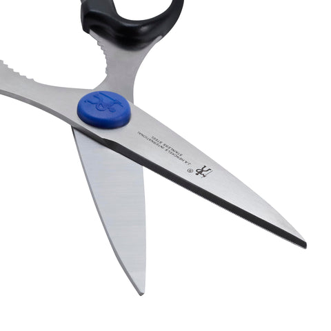 HENCKELS Take-Apart Kitchen Shears in action for precise cutting of herbs