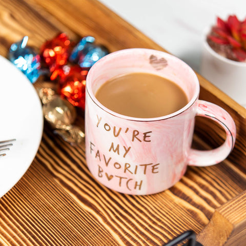 Hendson pink marble mug with gold accent handle for elegant mornings.