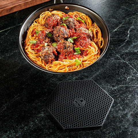 HexClad hexagon silicone trivet size reference measures approximately eight by seven inches