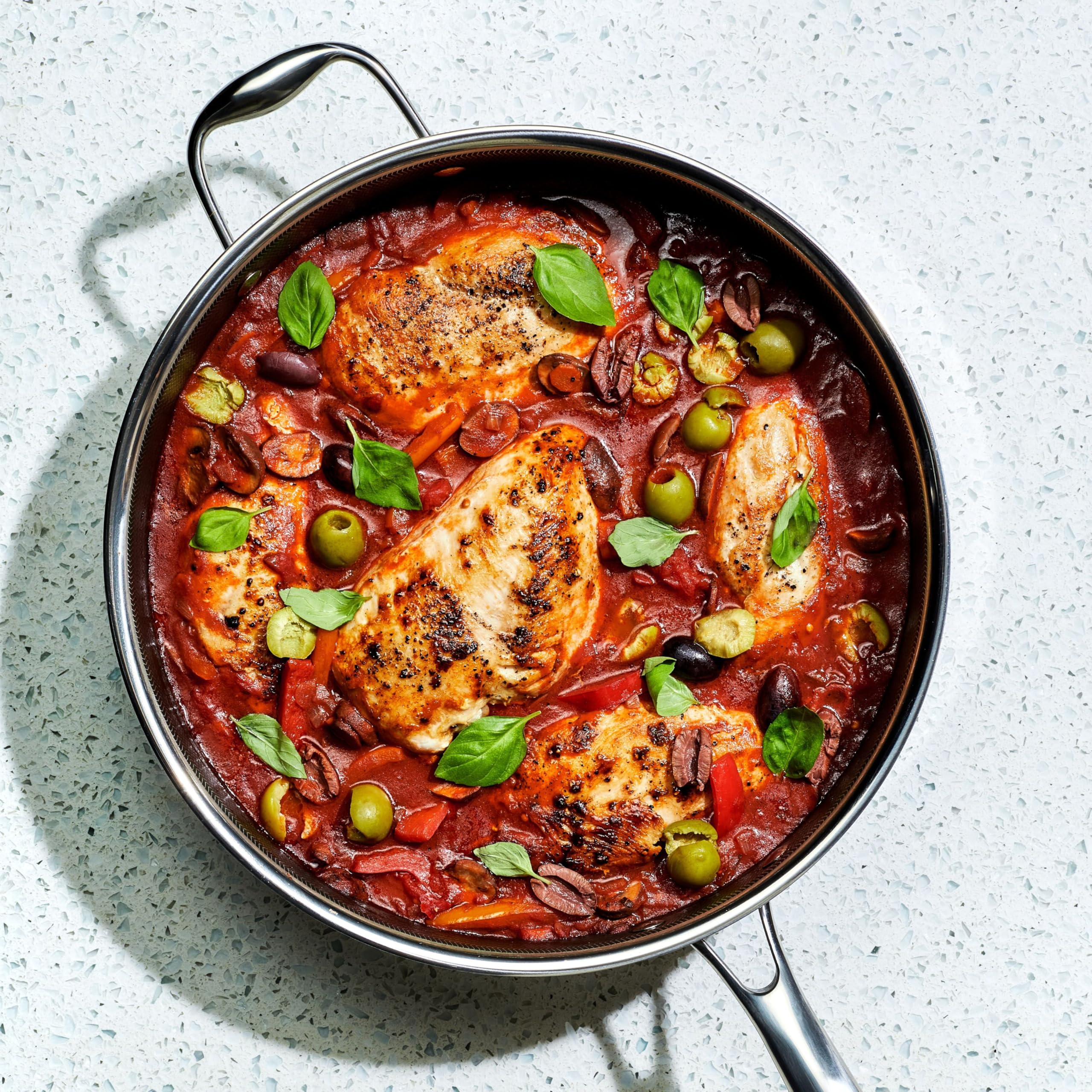 HexClad lid close-up featuring tempered glass for clear monitoring and steady heat.