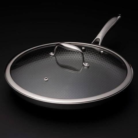HexClad 12-inch lid on pan showing steam vent for monitoring.