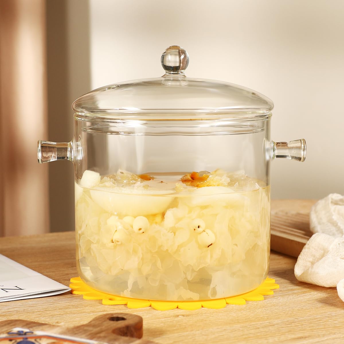 HHMJSM glass pot on stove showing see-through design during simmering