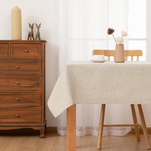 Hiasan faux linen tablecloth beige close-up texture shows weave that enhances table aesthetics.