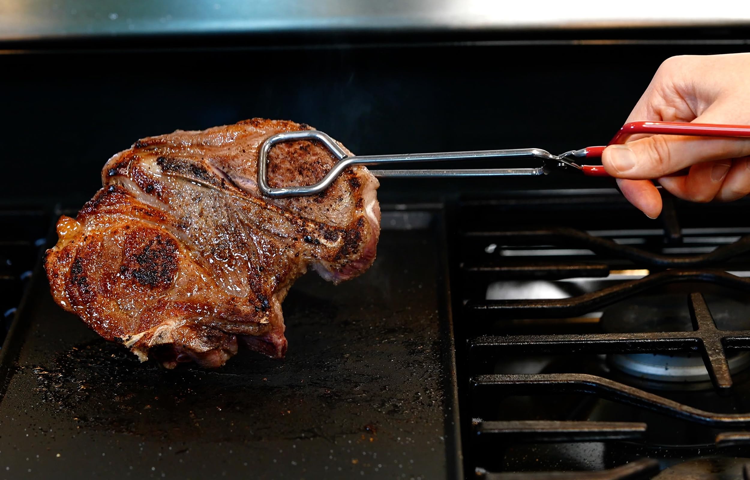 Hiash tongs with threaded tips for gripping meats and delicate items.