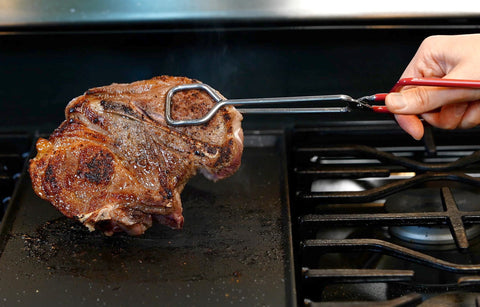 Hiash tongs with threaded tips for gripping meats and delicate items.