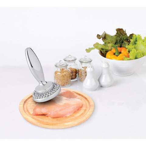 HIC Kitchen dual meat tenderizer placed on cutting board for safe use