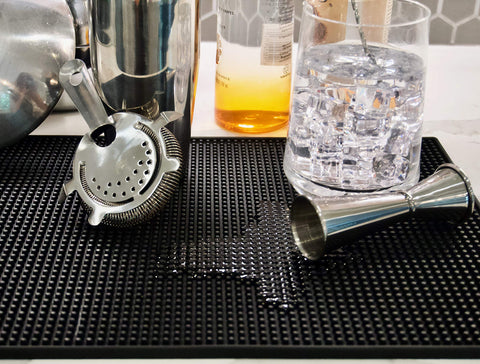 Highball & Chaser bar mat features non-slip back to prevent movement.