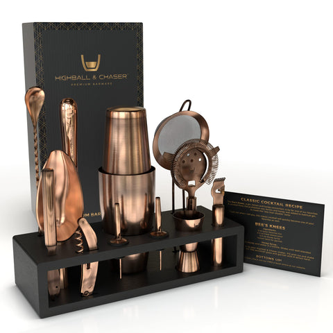 Highball & Chaser bartender kit with black bamboo stand shown on a bar shelf for organized storage