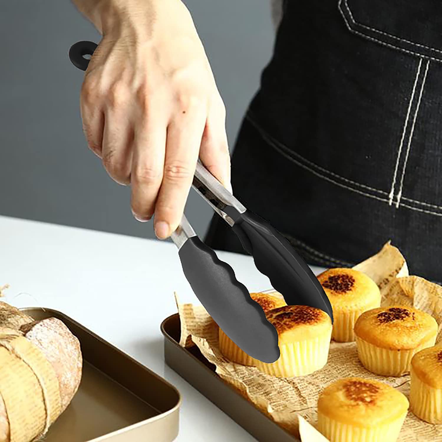 HINMAY black mini tongs laid out for table service.